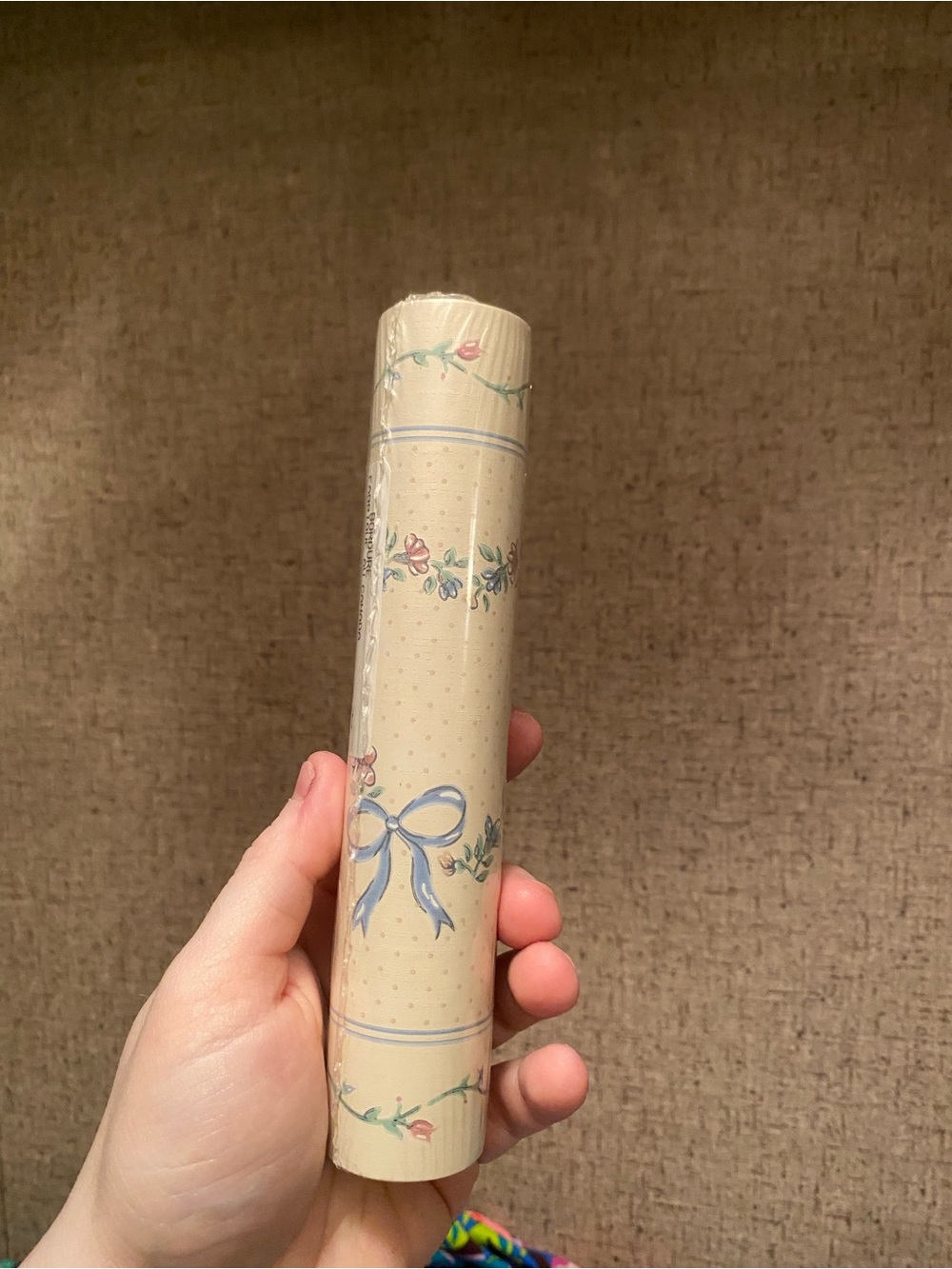 Cream Wallpaper Roll with Blue Ribbon and Floral Motif